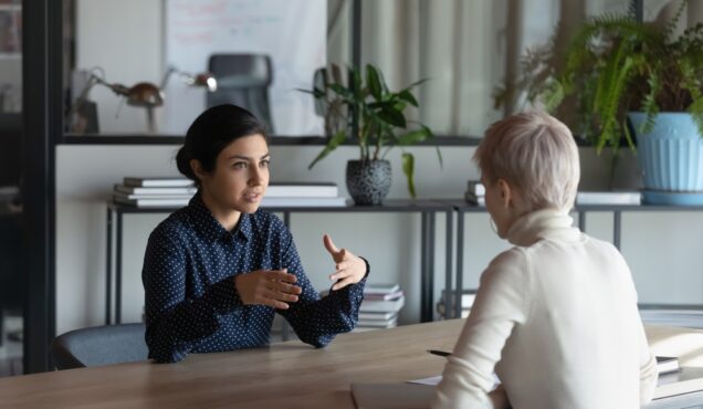 Indian,Female,Business,Mentor,Training,Intern,,Explaining,Work,Task,To