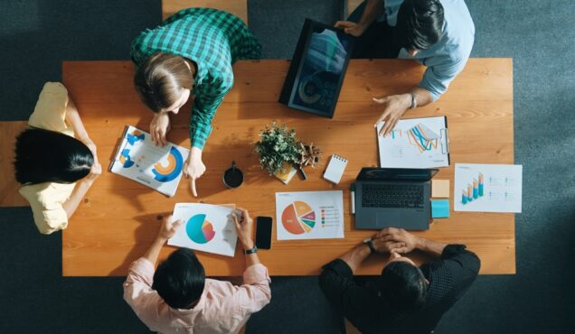 Top,View,Of,Project,Manager,Using,Tablet,To,Analyze,Data